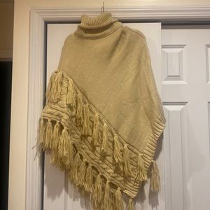Anthropologie knit poncho with tassels